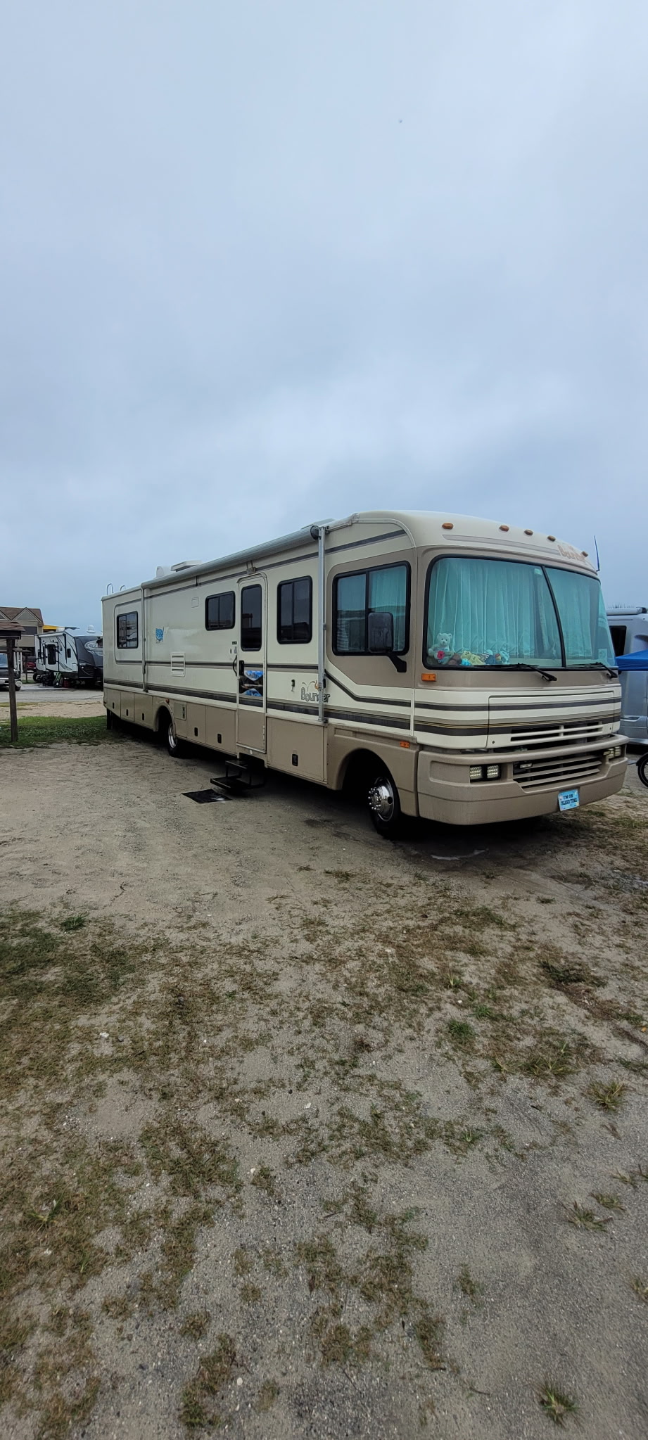 RV parked in a lot before a detail